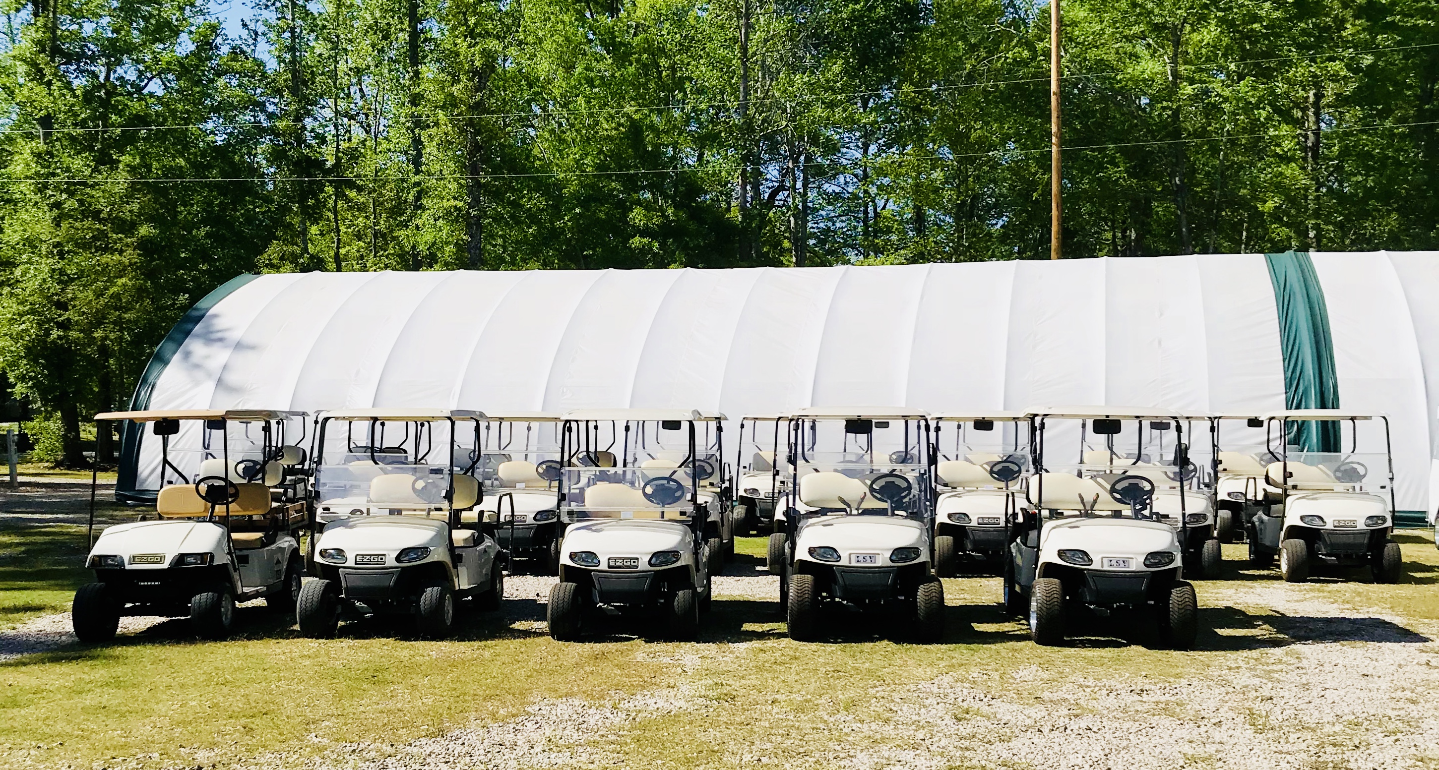 Row of Grab-a-Cart golf carts ready for rent in Auburn, Alabama